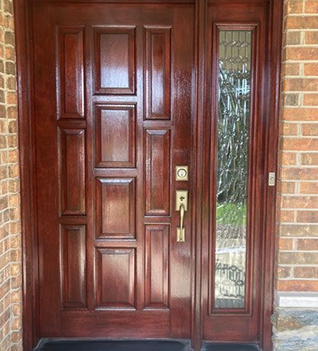 a wooden door with a glass window 