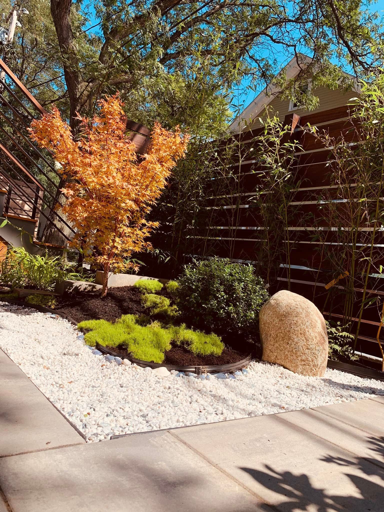 There is a rock in the middle of the garden.