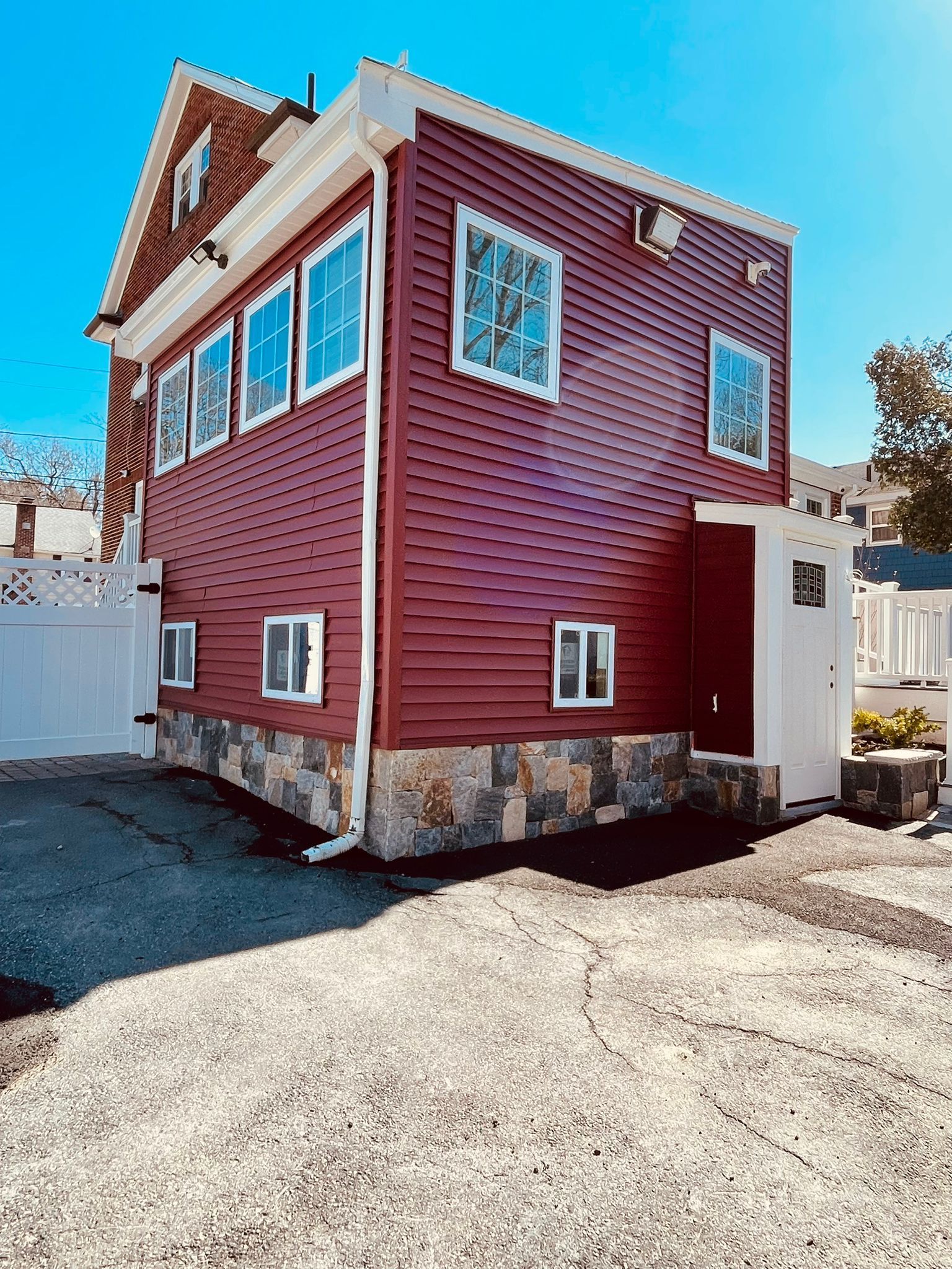 A large red house with a lot of windows