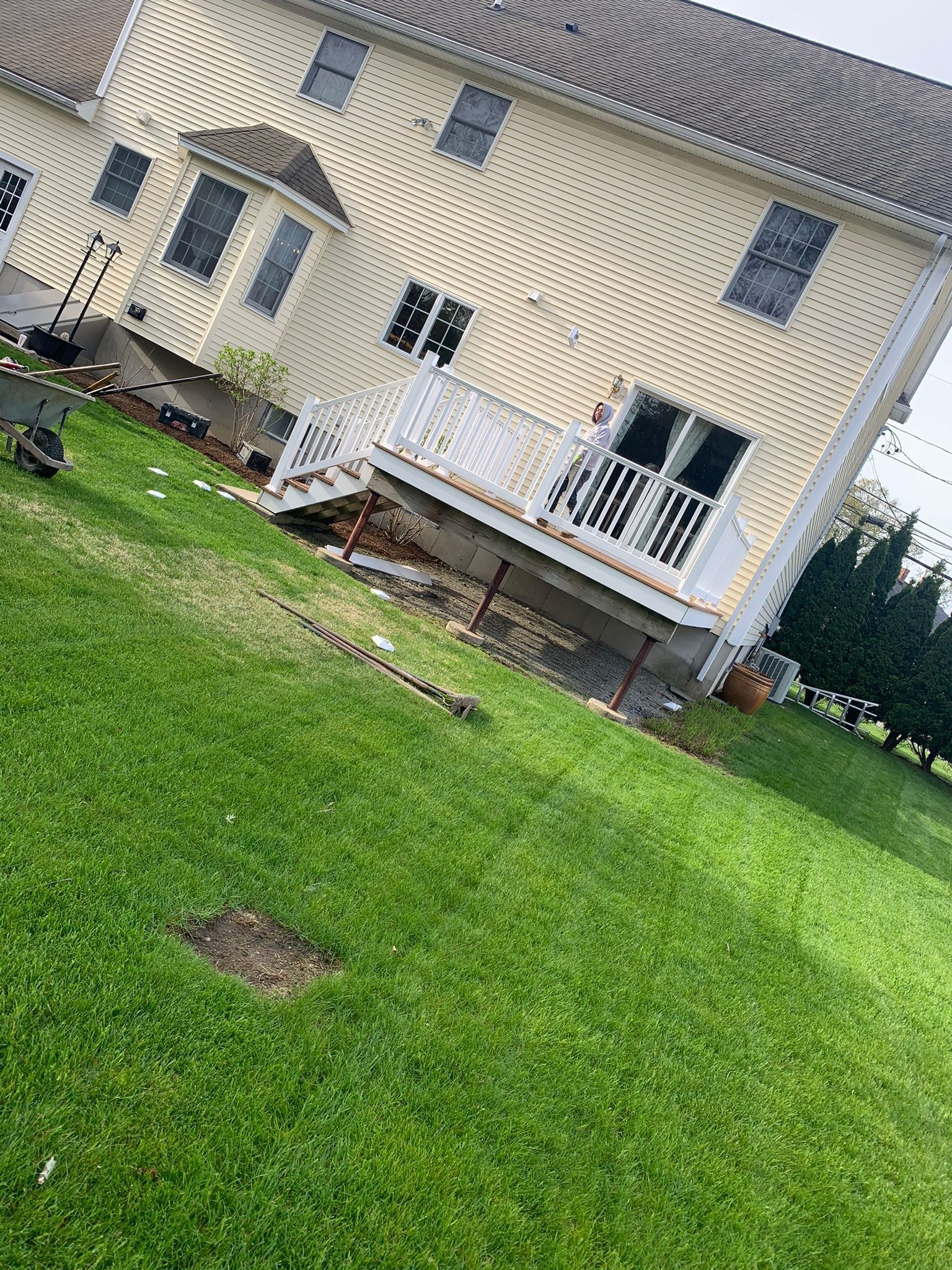 A large house with a large lawn in front of it.