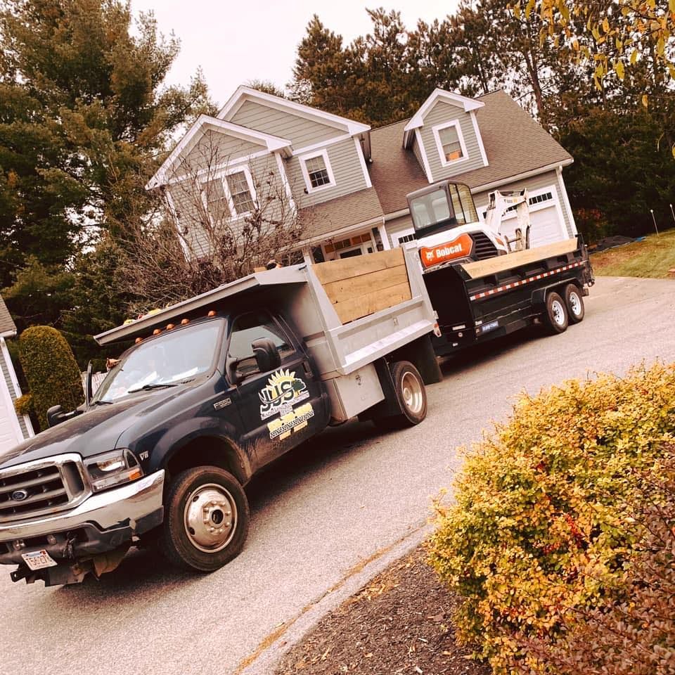 A tow truck is parked in front of a house