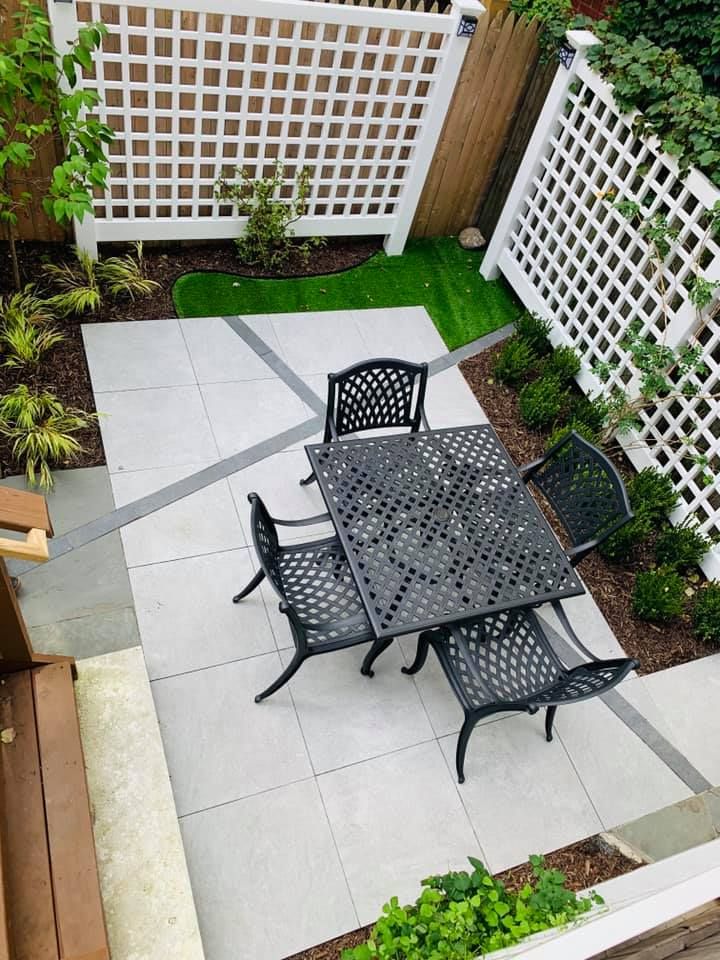 An aerial view of a patio with a table and chairs.