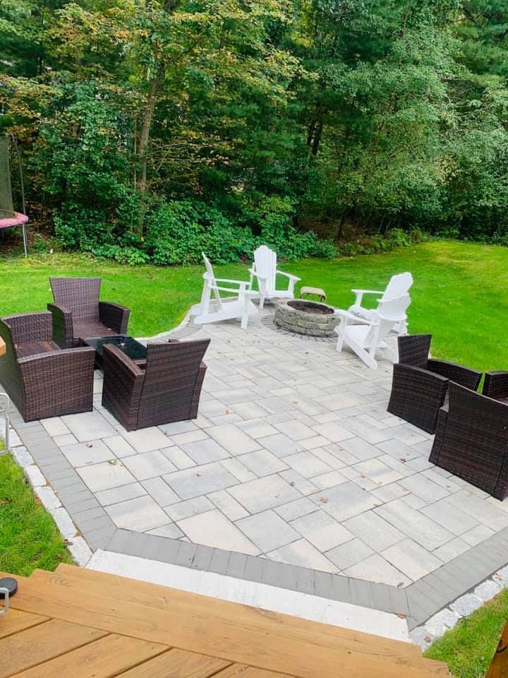 There is a fire pit in the middle of the patio.