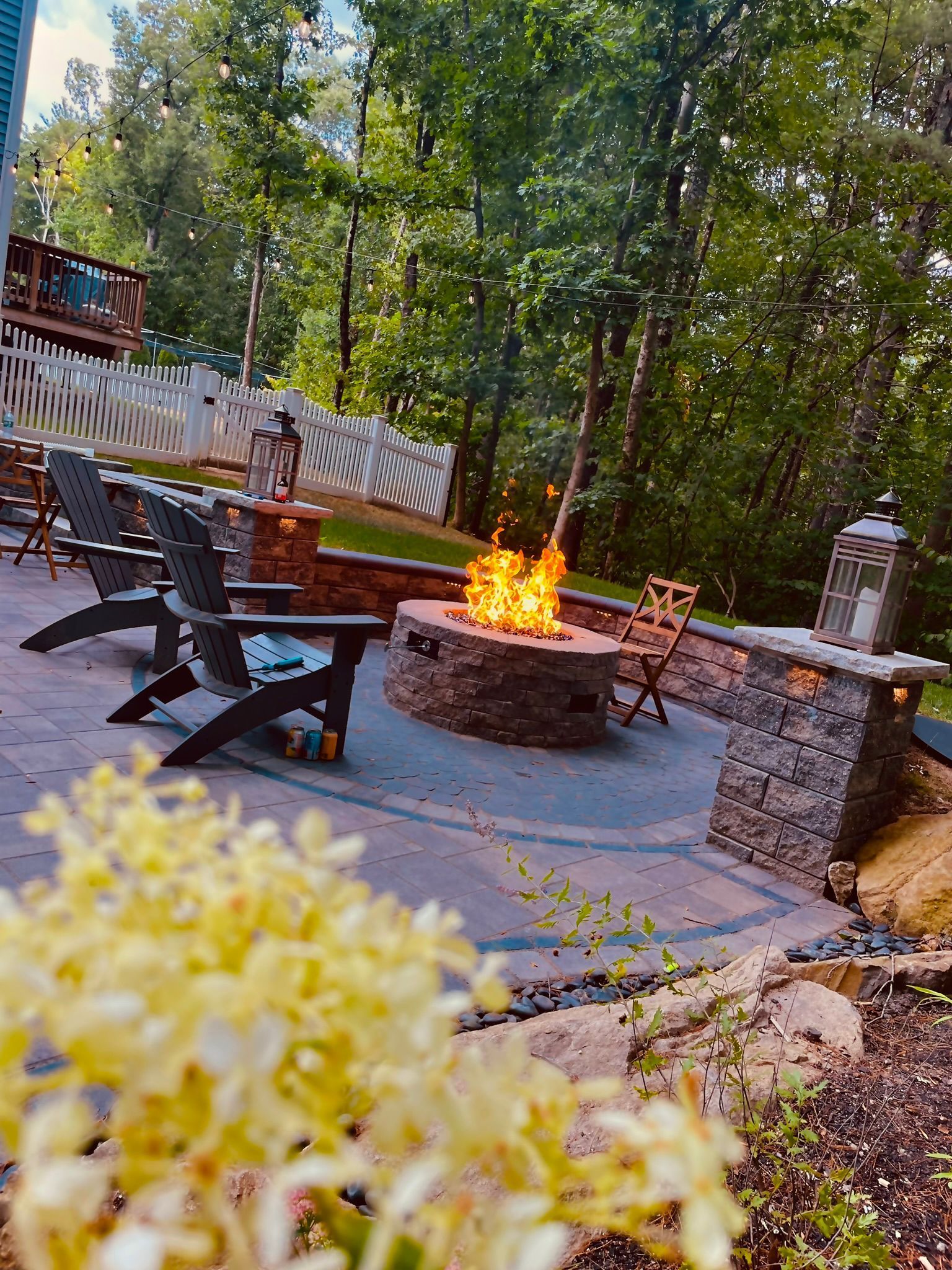 There is a fire pit in the middle of the patio.