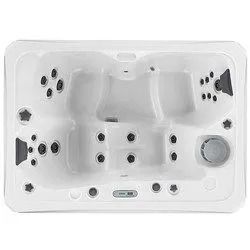 Overhead view of a white, rectangular hot tub with multiple jets and seating areas.