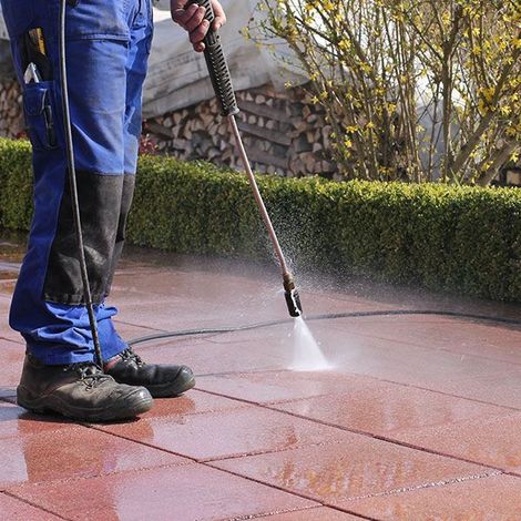 Pressure washing a tiled floor