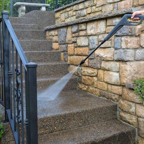 Pressure washing a concrete stair