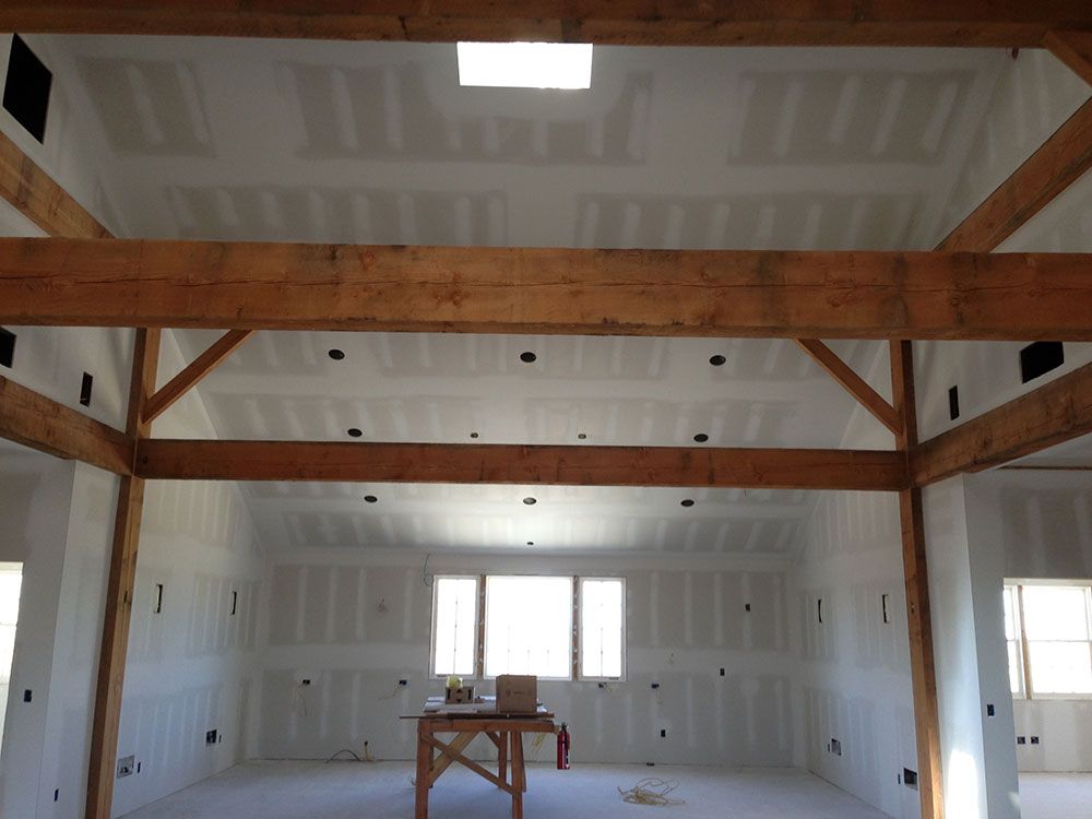 A room with a ceiling that has a skylight in it