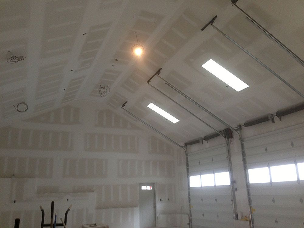 A large building with a lot of windows and a light on the ceiling