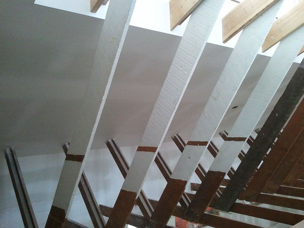 A staircase with a wooden railing and white steps