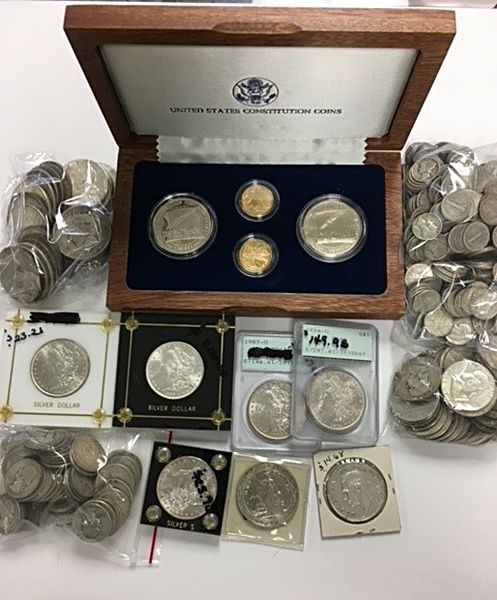 A collection of coins including a united states constitution coin set