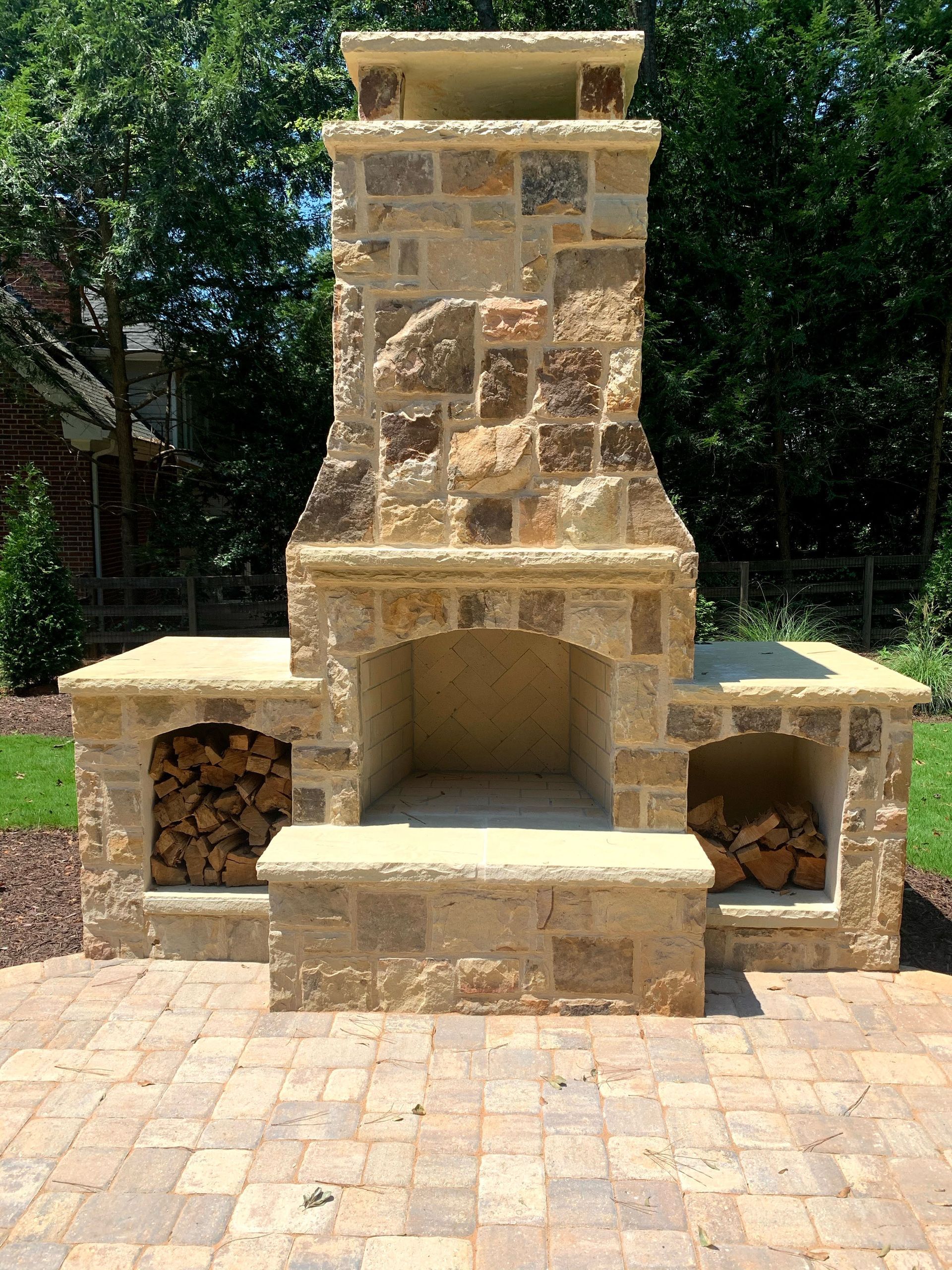 The front entrance of a large brick house with a covered porch.