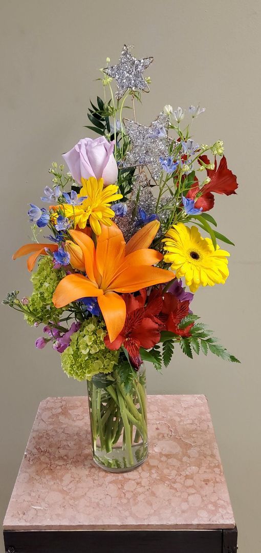 A vase filled with flowers is sitting on a table.