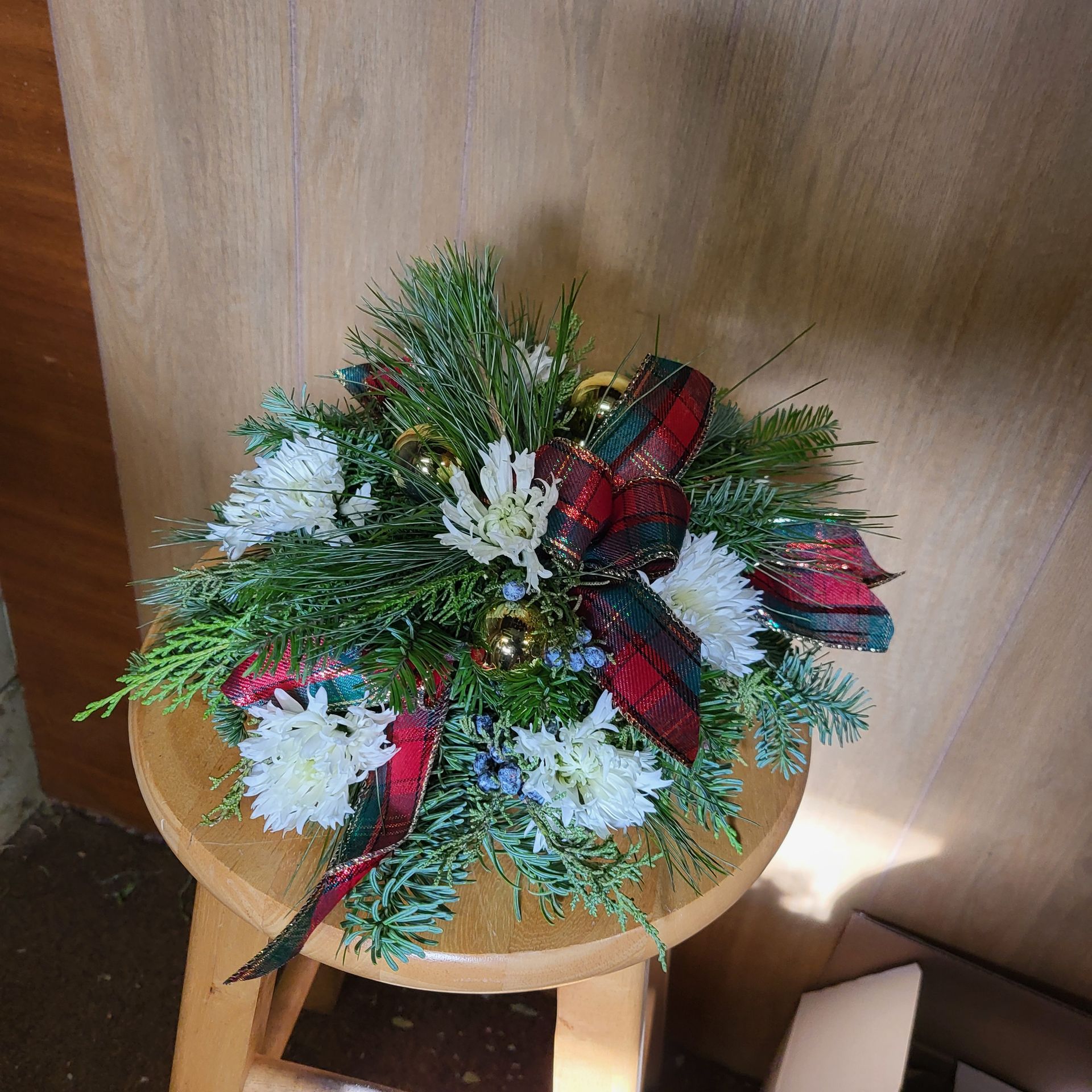 A vase filled with flowers is sitting on a table.