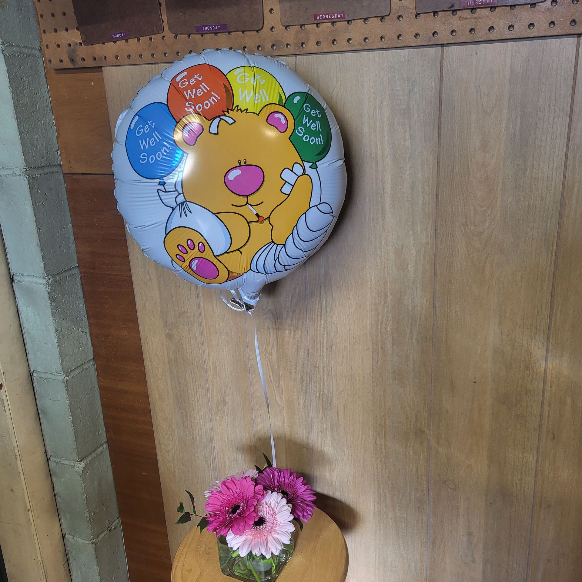 A vase filled with flowers is sitting on a table.