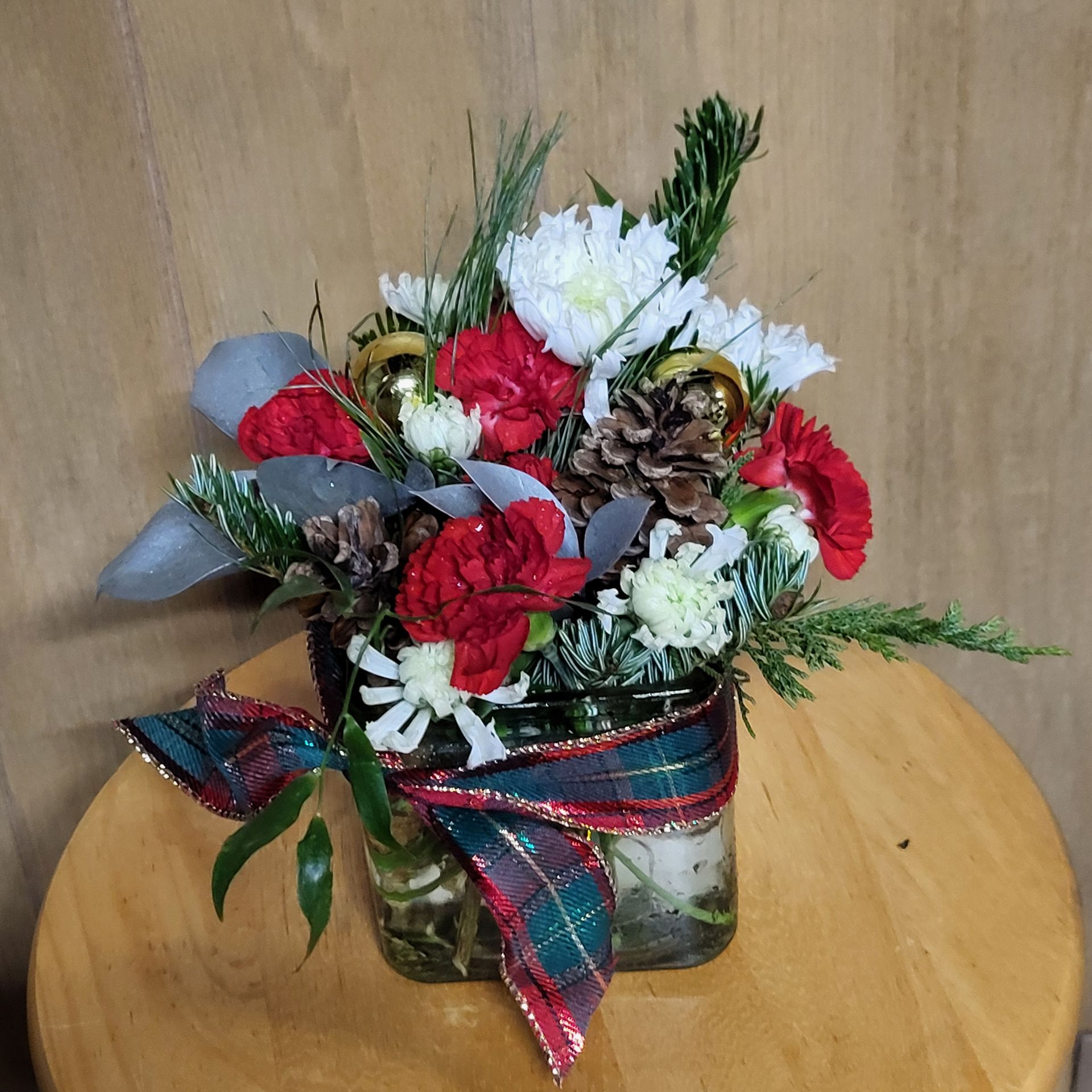 A vase filled with flowers is sitting on a table.