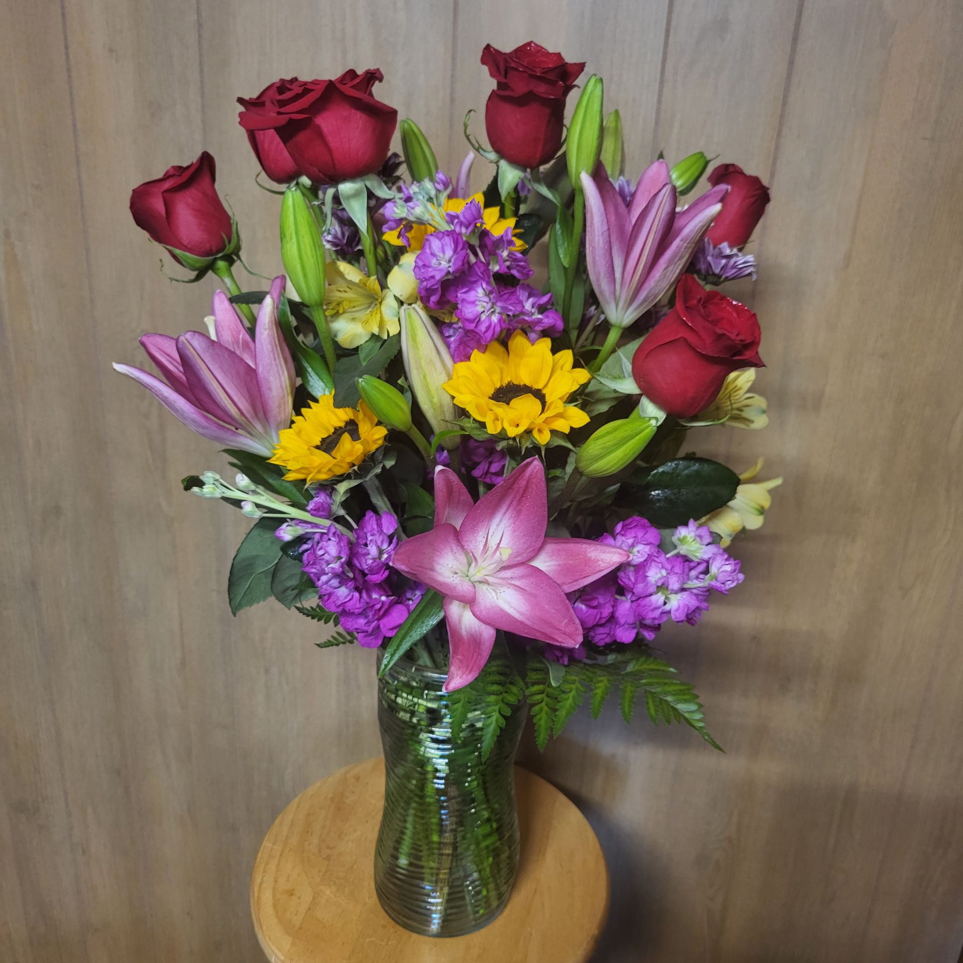 A vase filled with flowers is sitting on a table.
