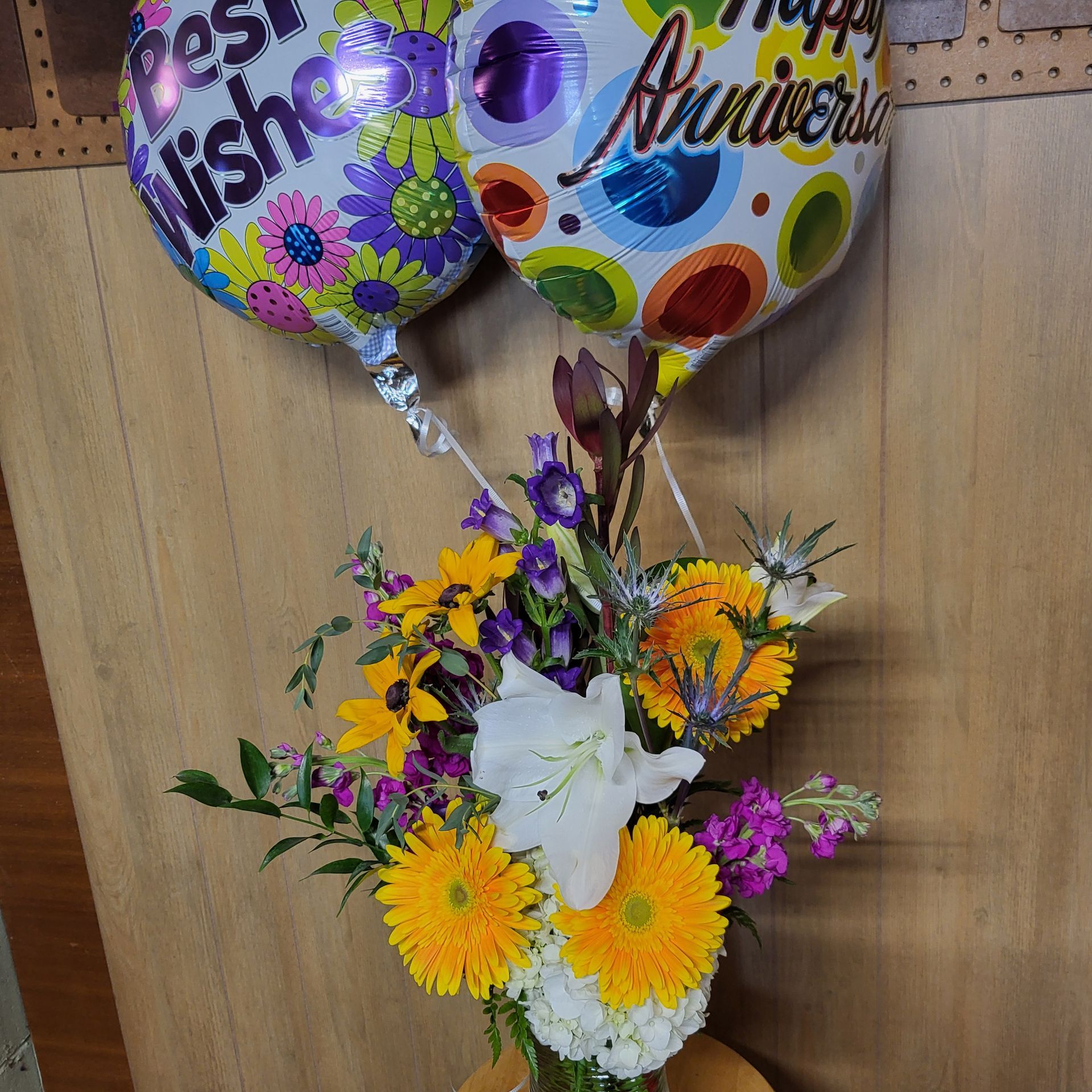 A vase filled with flowers is sitting on a table.