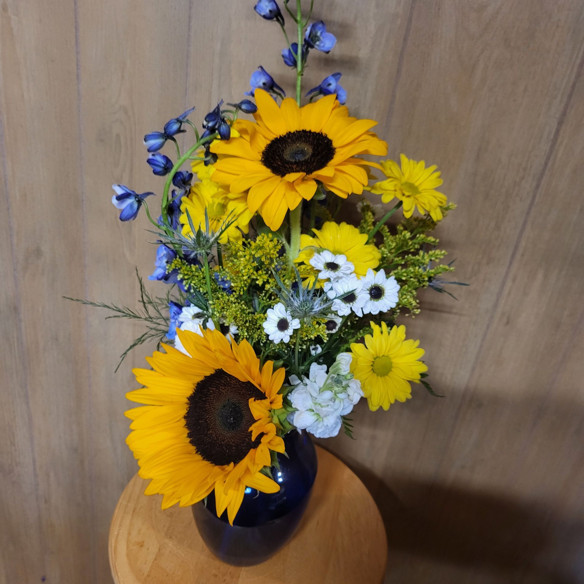 A vase filled with flowers is sitting on a table.