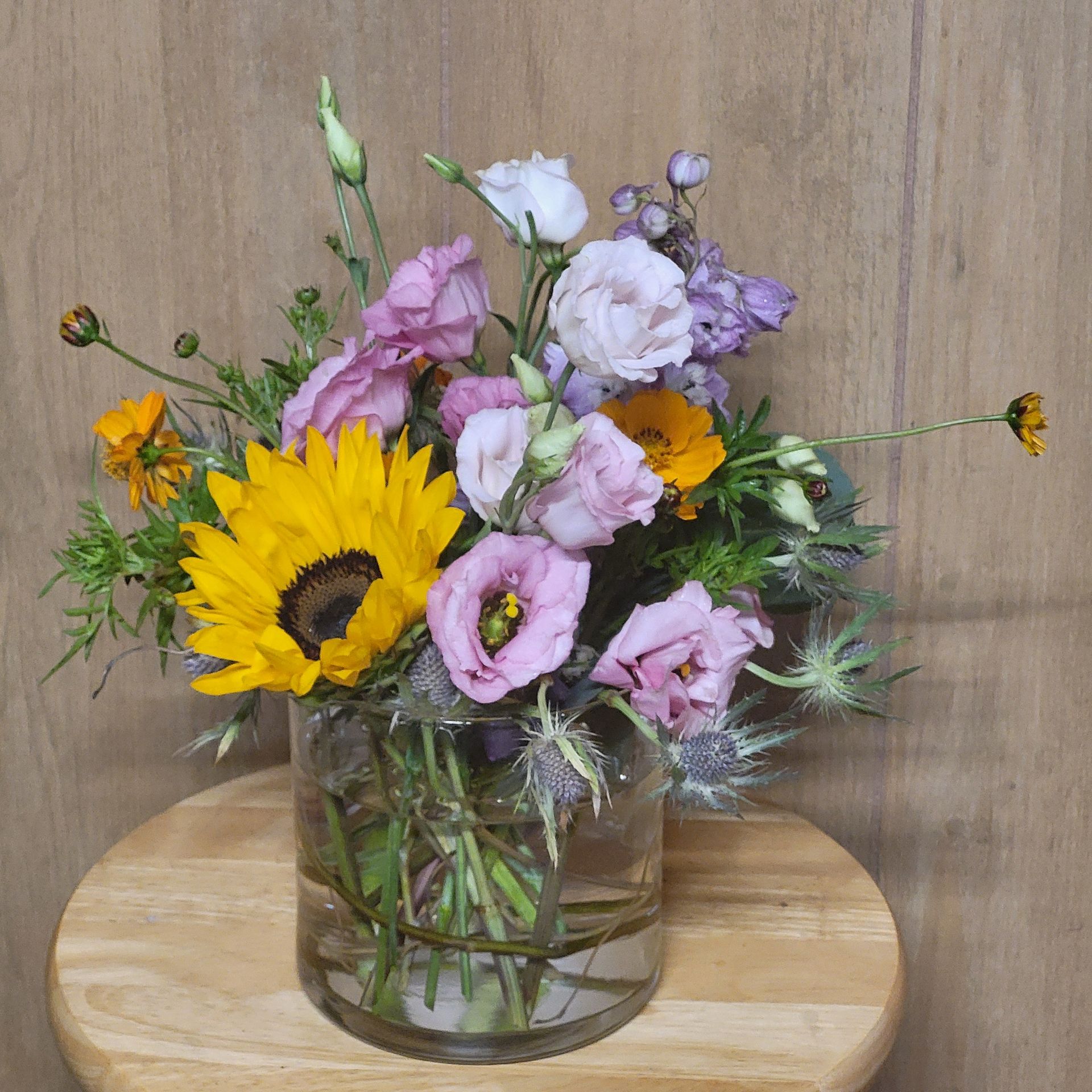 A vase filled with flowers is sitting on a table.