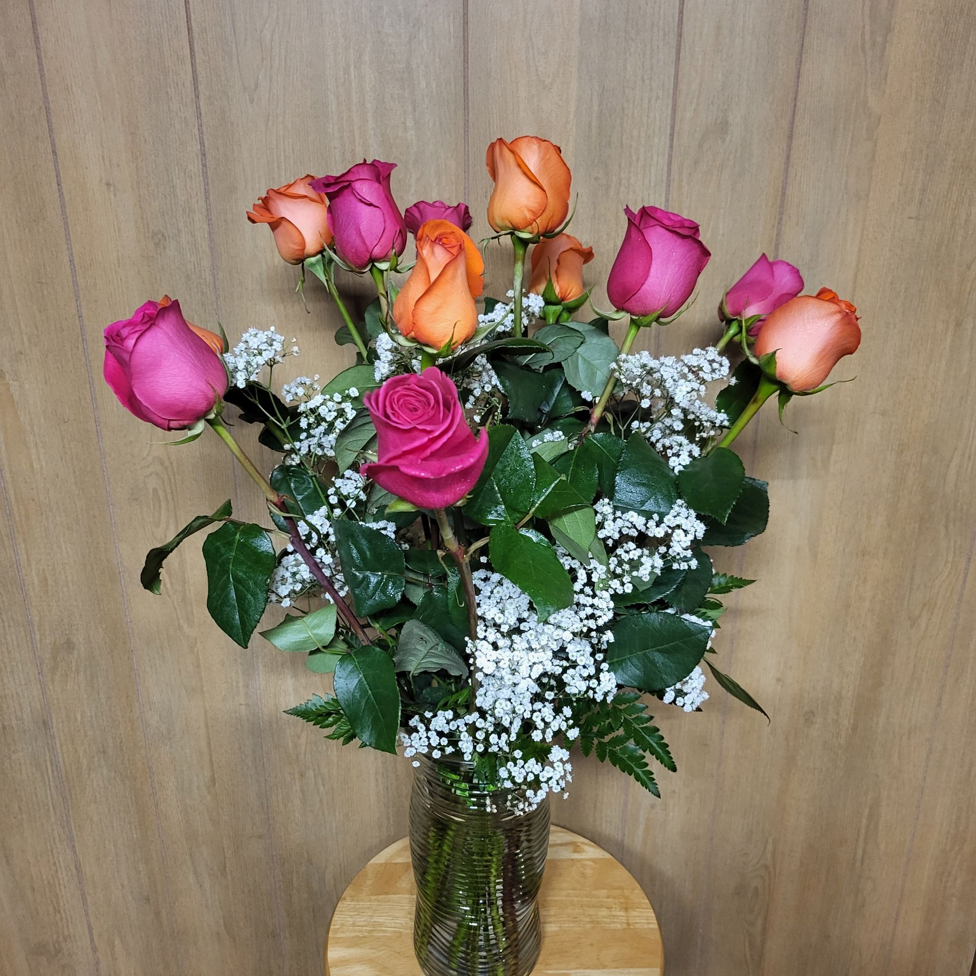 A vase filled with flowers is sitting on a table.