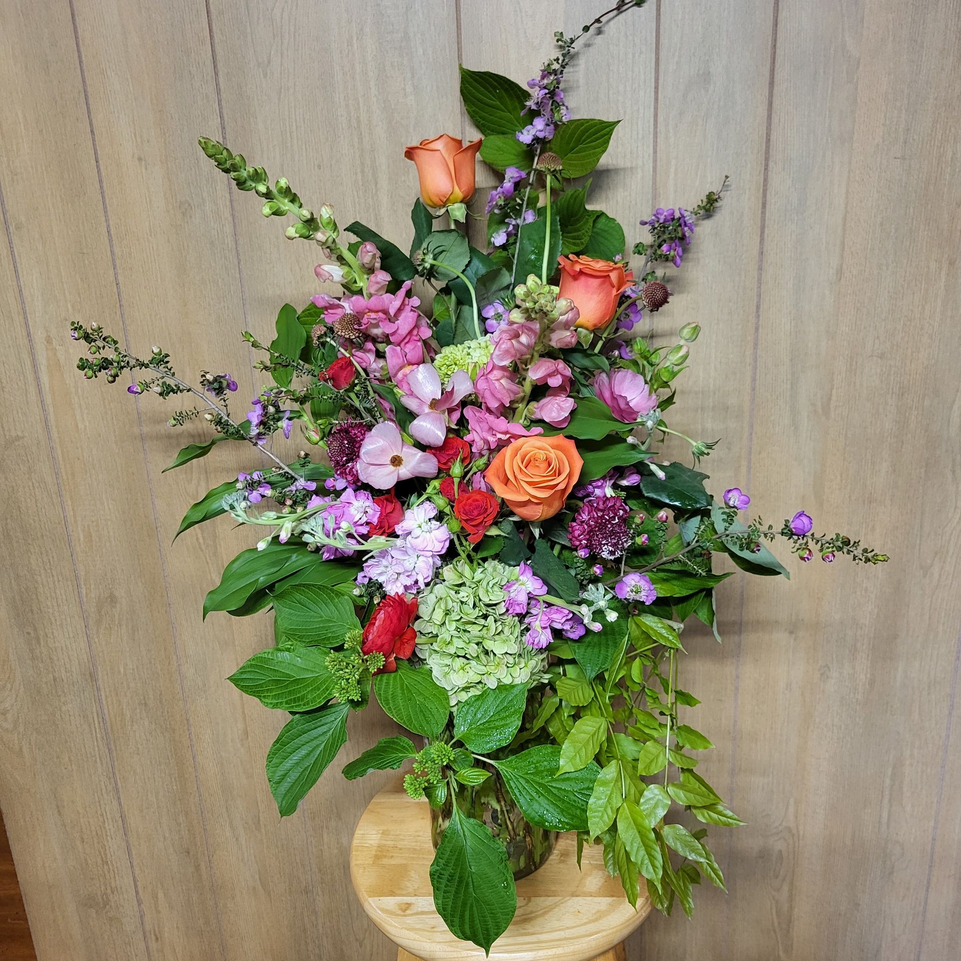 A vase filled with flowers is sitting on a table.