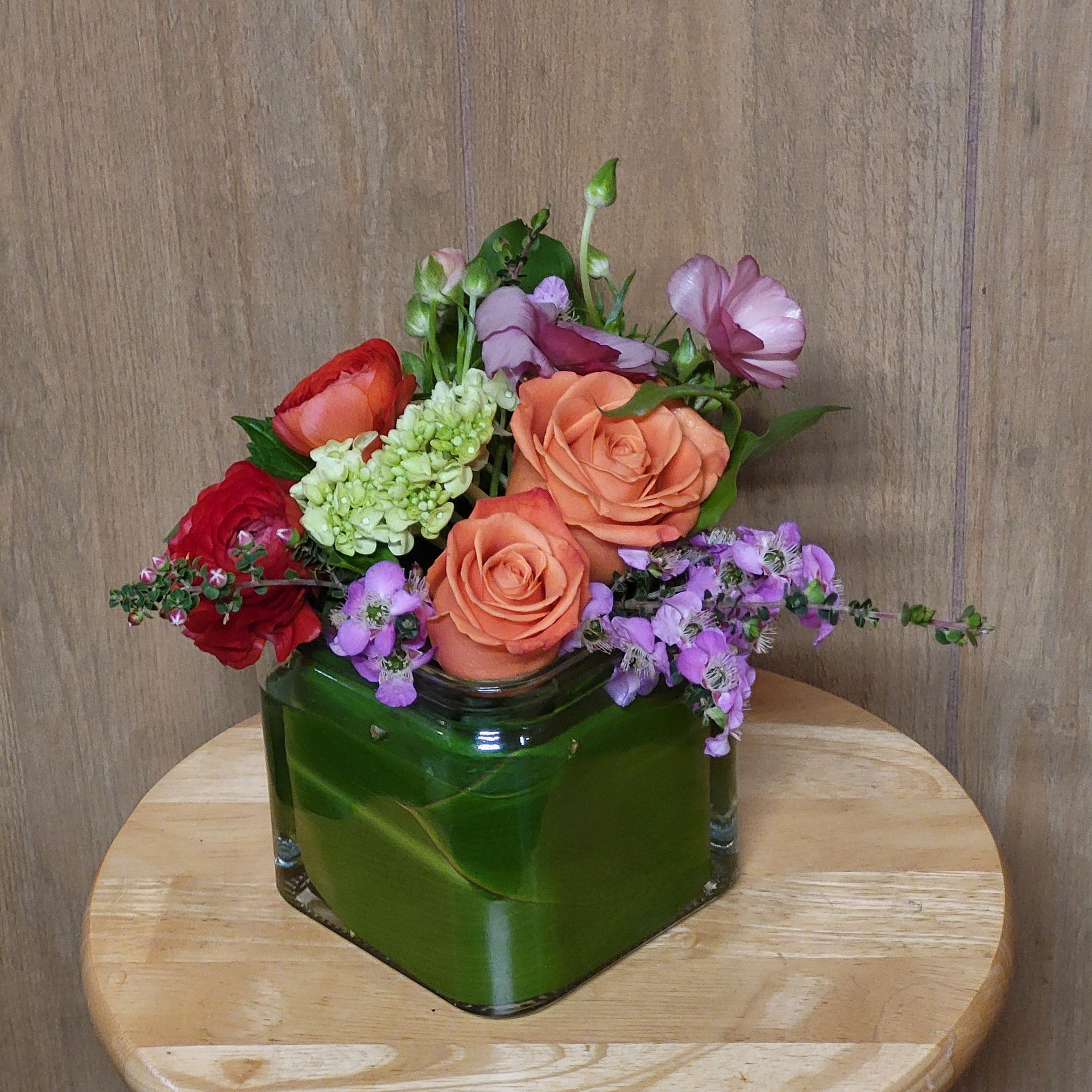 A vase filled with flowers is sitting on a table.