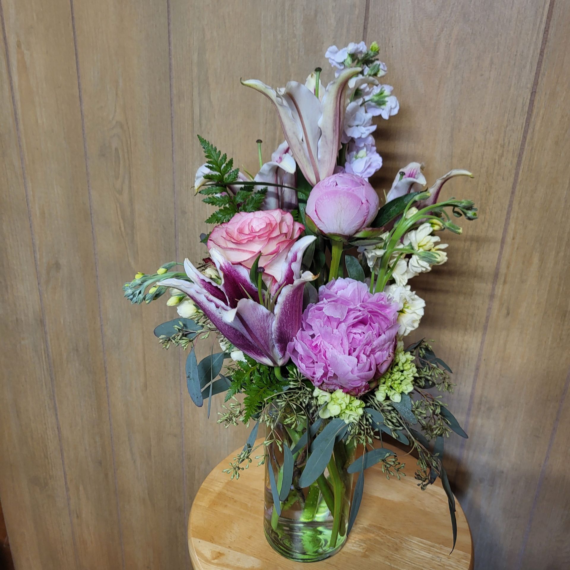 A vase filled with flowers is sitting on a table.