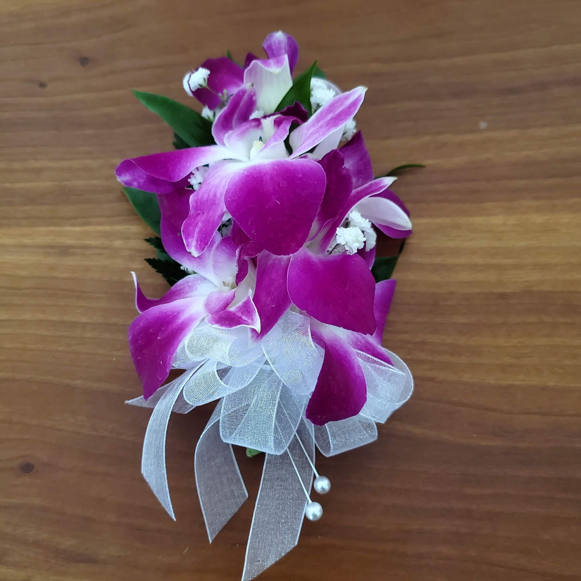 A vase filled with flowers is sitting on a table.