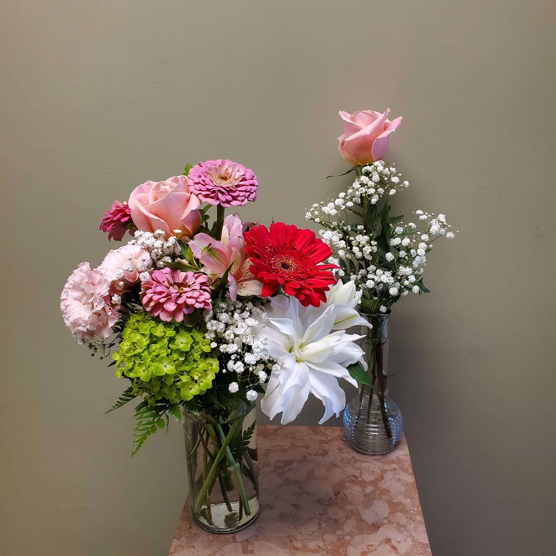 A vase filled with flowers is sitting on a table.