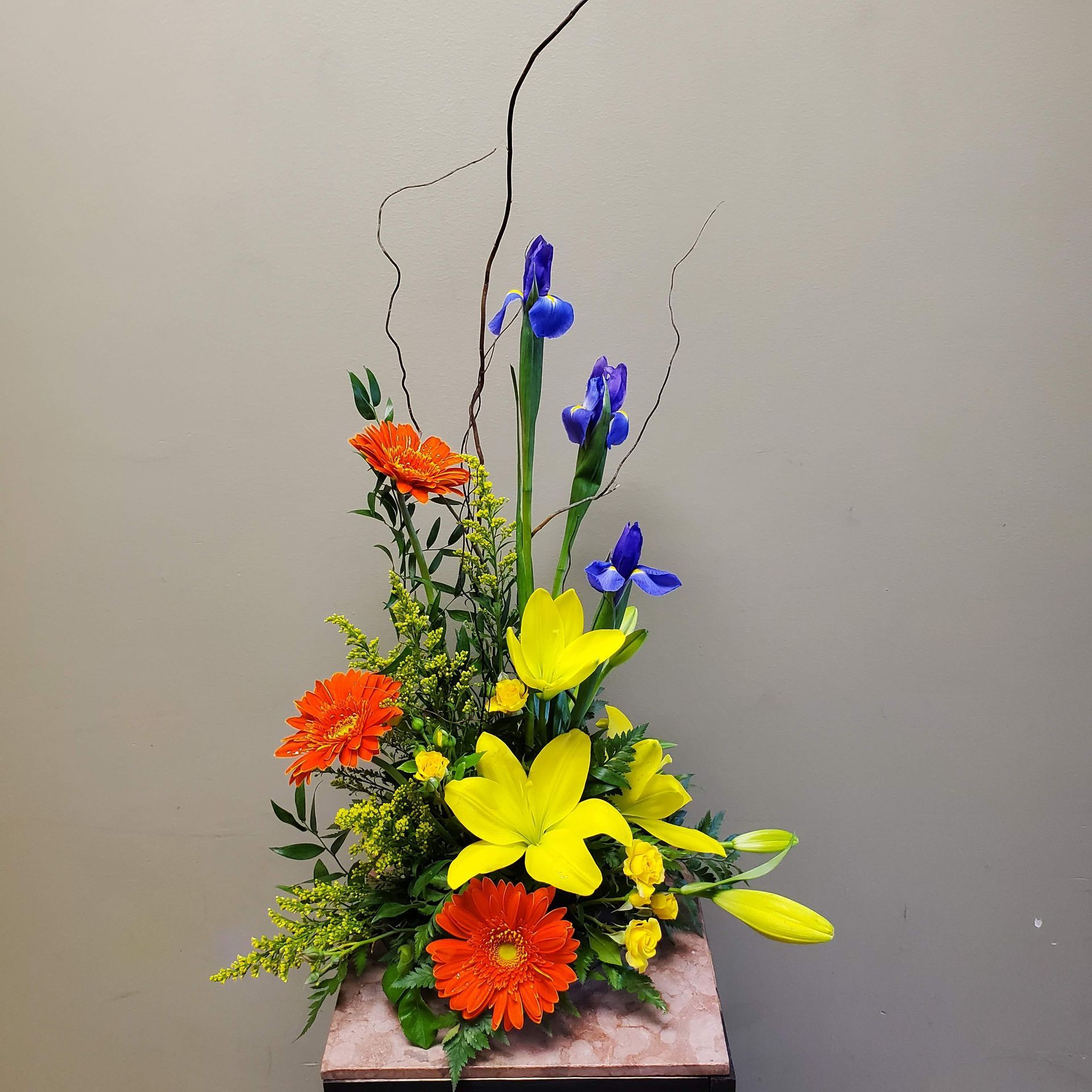 A vase filled with flowers is sitting on a table.