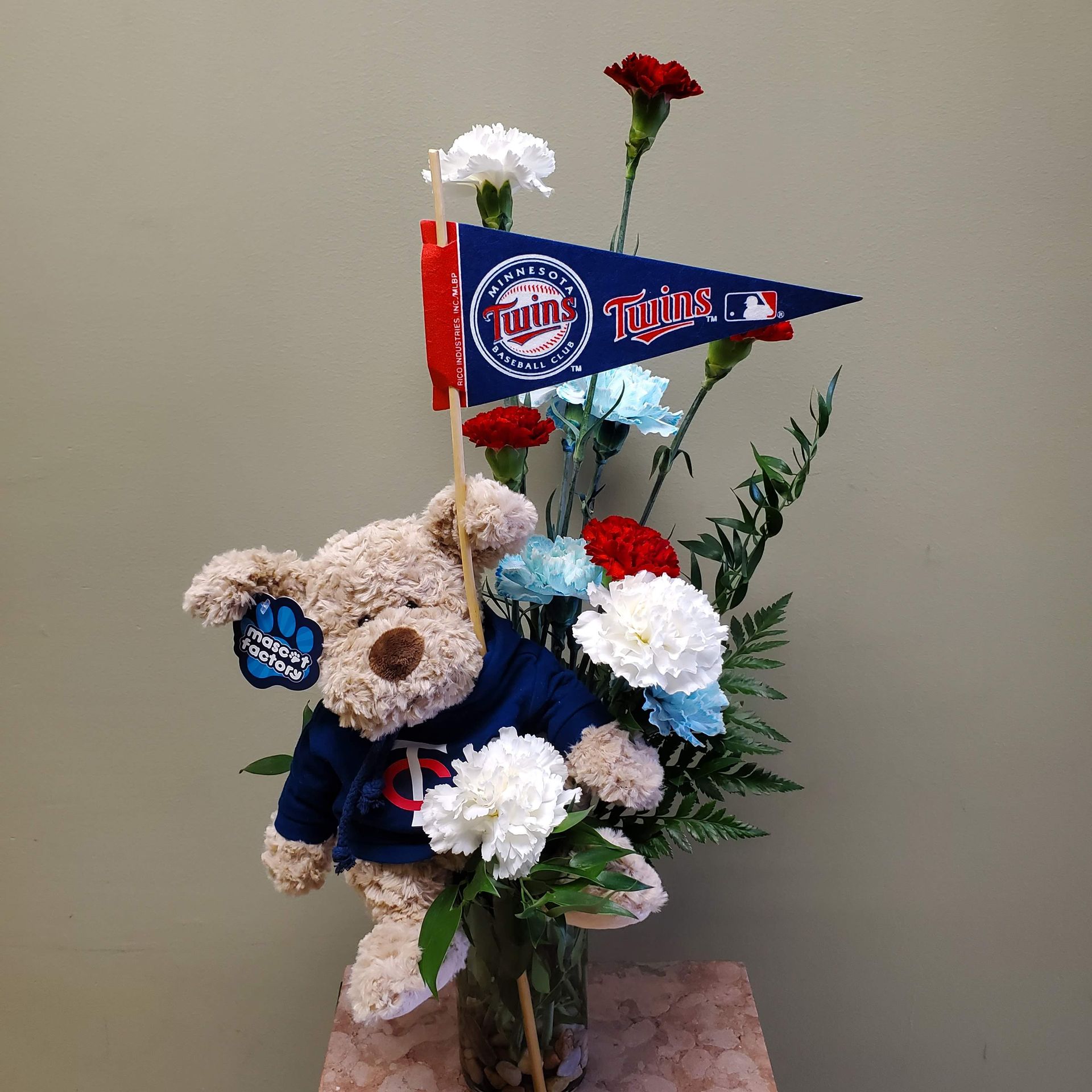 A vase filled with flowers is sitting on a table.