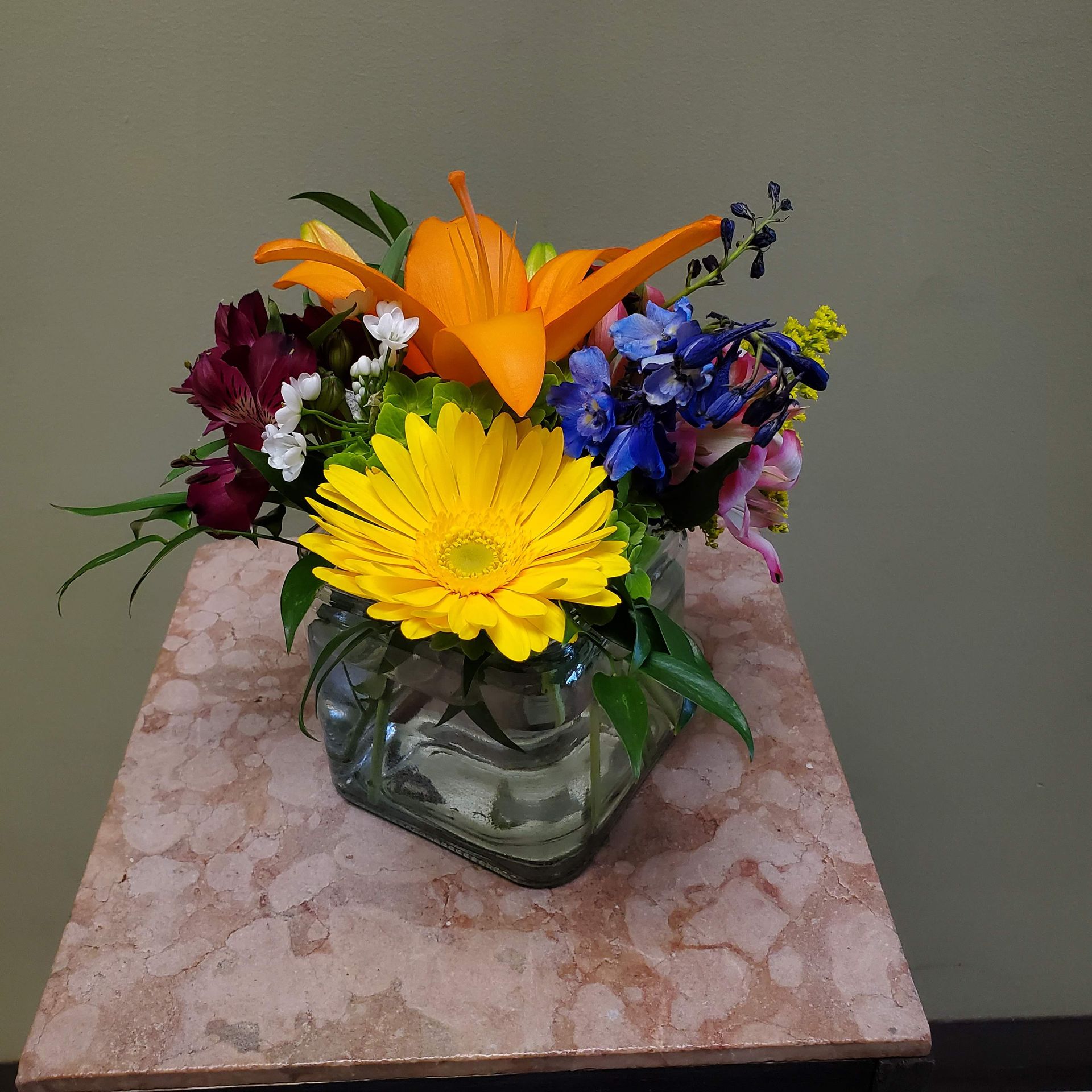 A vase filled with flowers is sitting on a table.