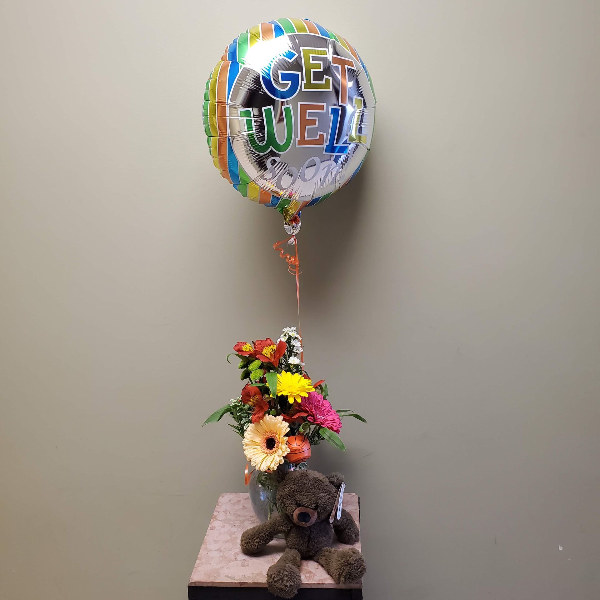A vase filled with flowers is sitting on a table.