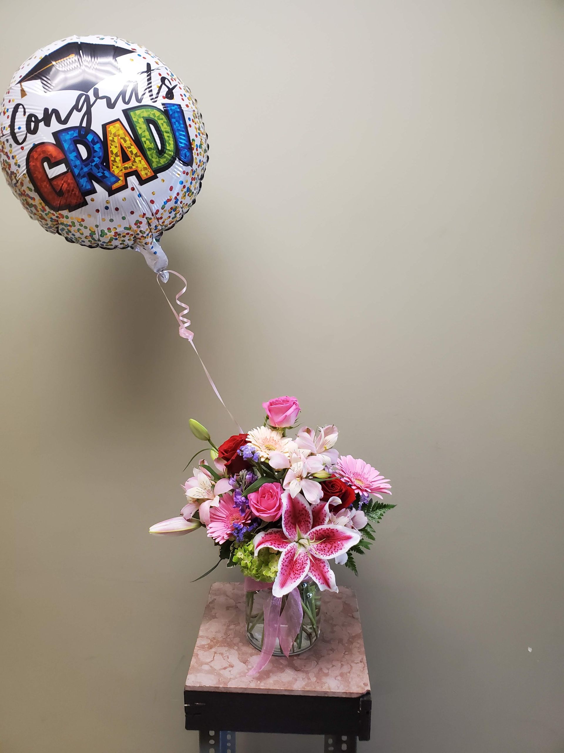 A vase filled with flowers is sitting on a table.