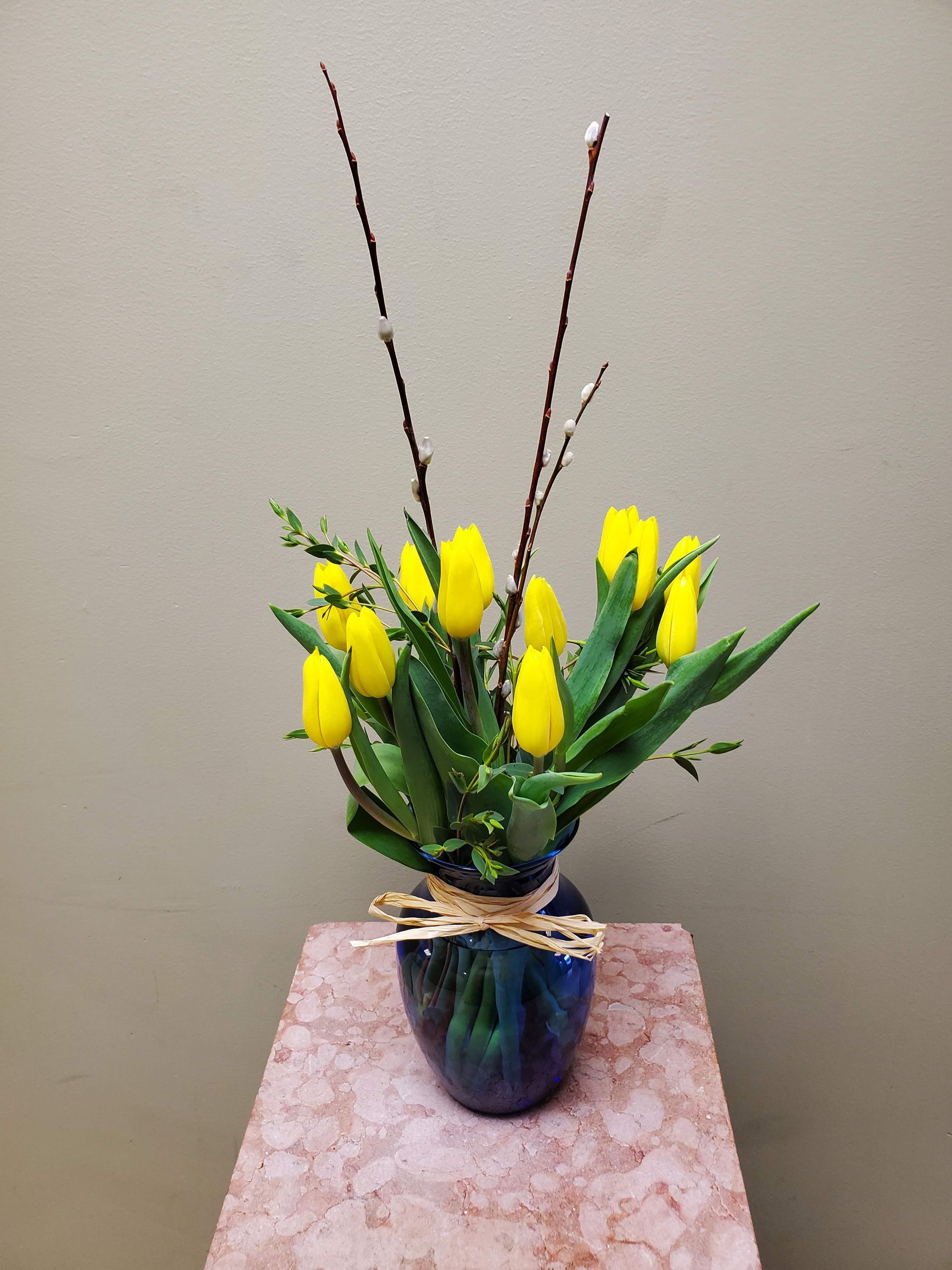 A vase filled with flowers is sitting on a table.