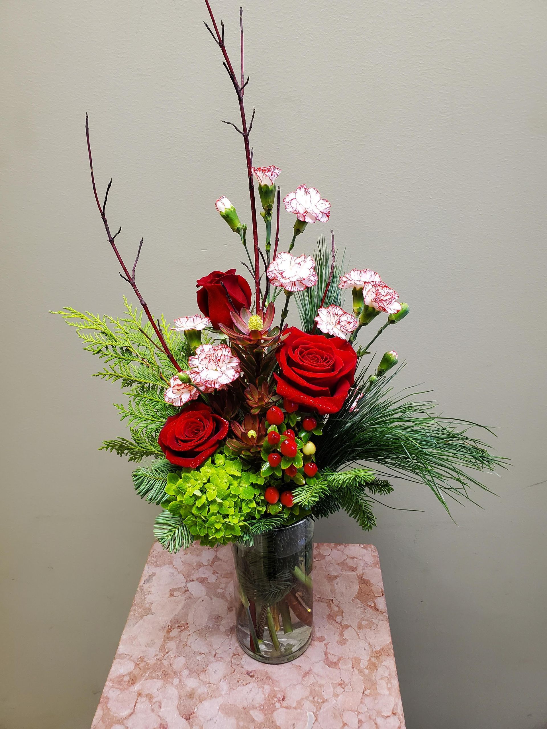 A vase filled with flowers is sitting on a table.
