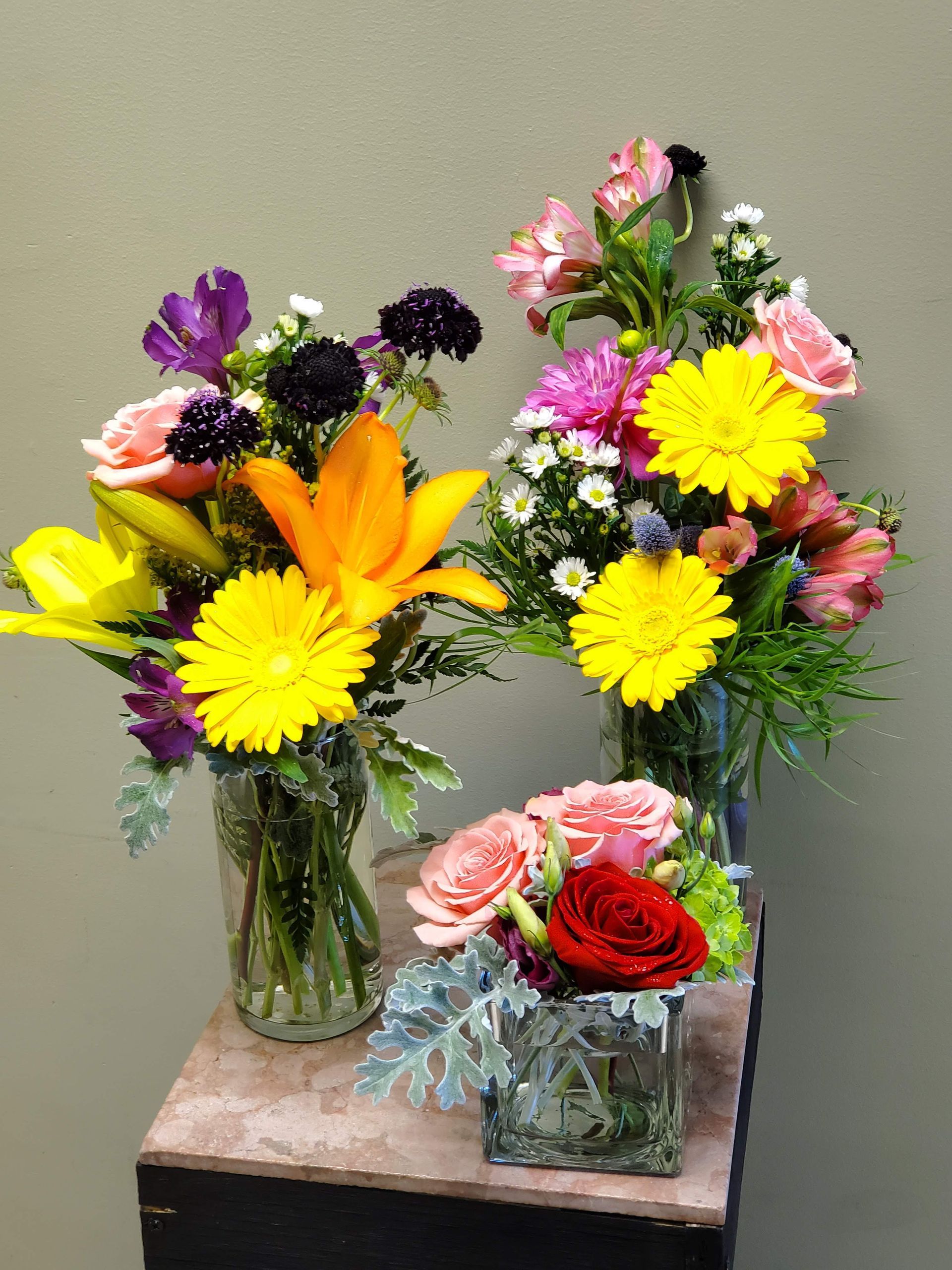 A vase filled with flowers is sitting on a table.