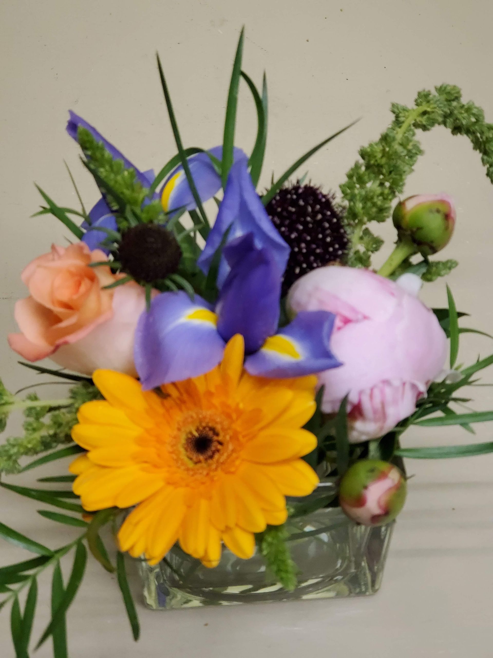 A vase filled with flowers is sitting on a table.