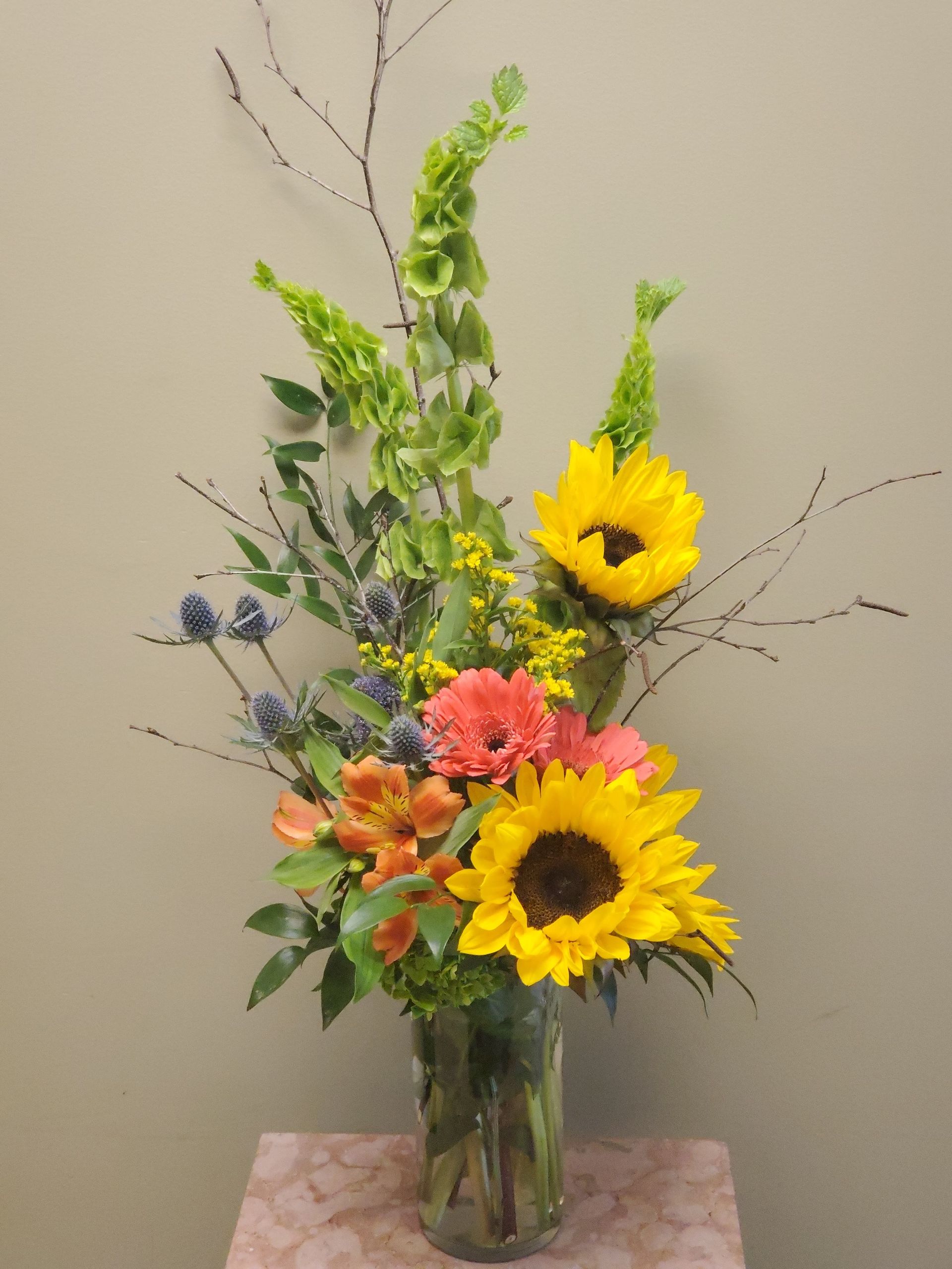 A vase filled with flowers is sitting on a table.