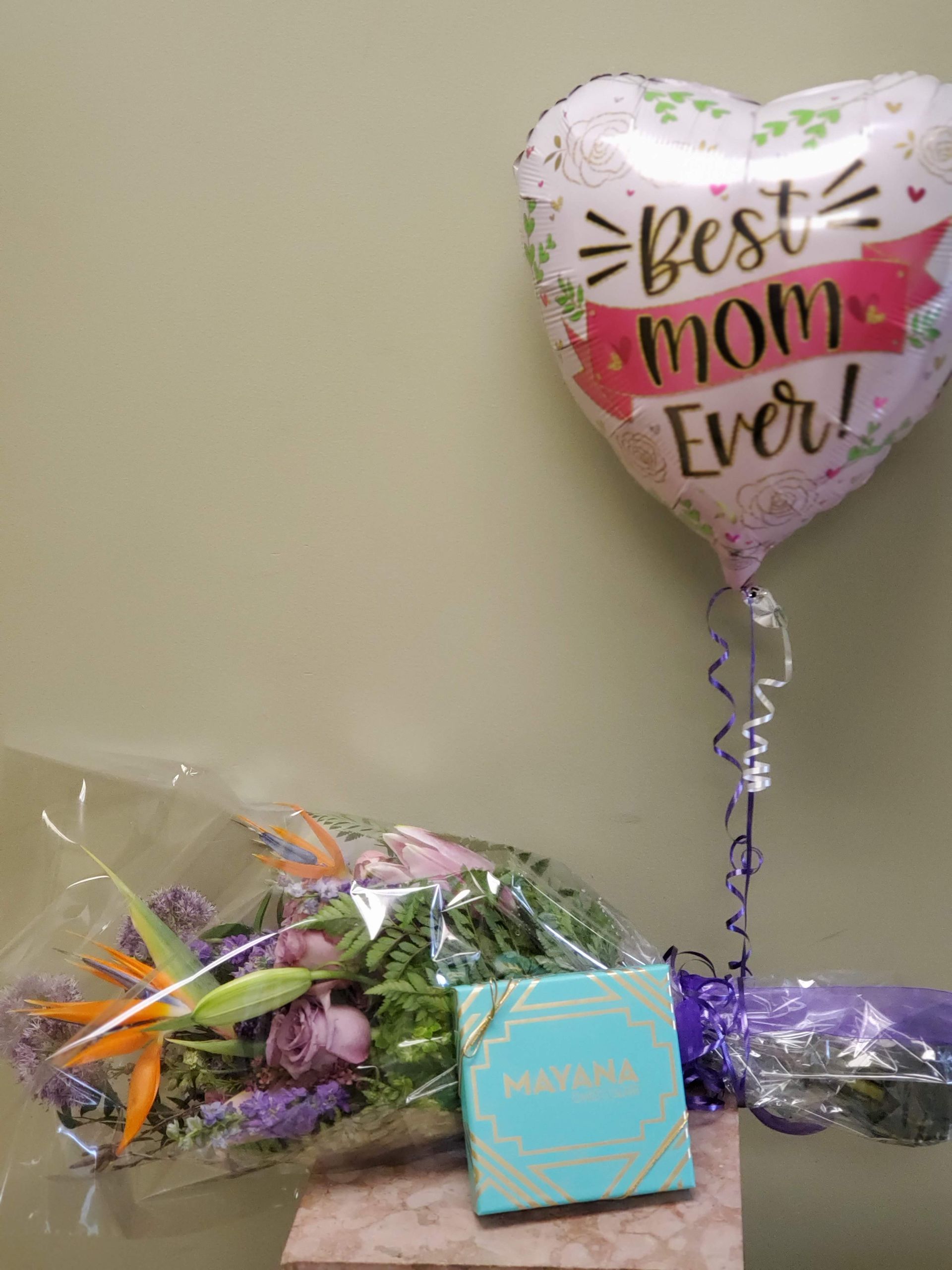 A vase filled with flowers is sitting on a table.
