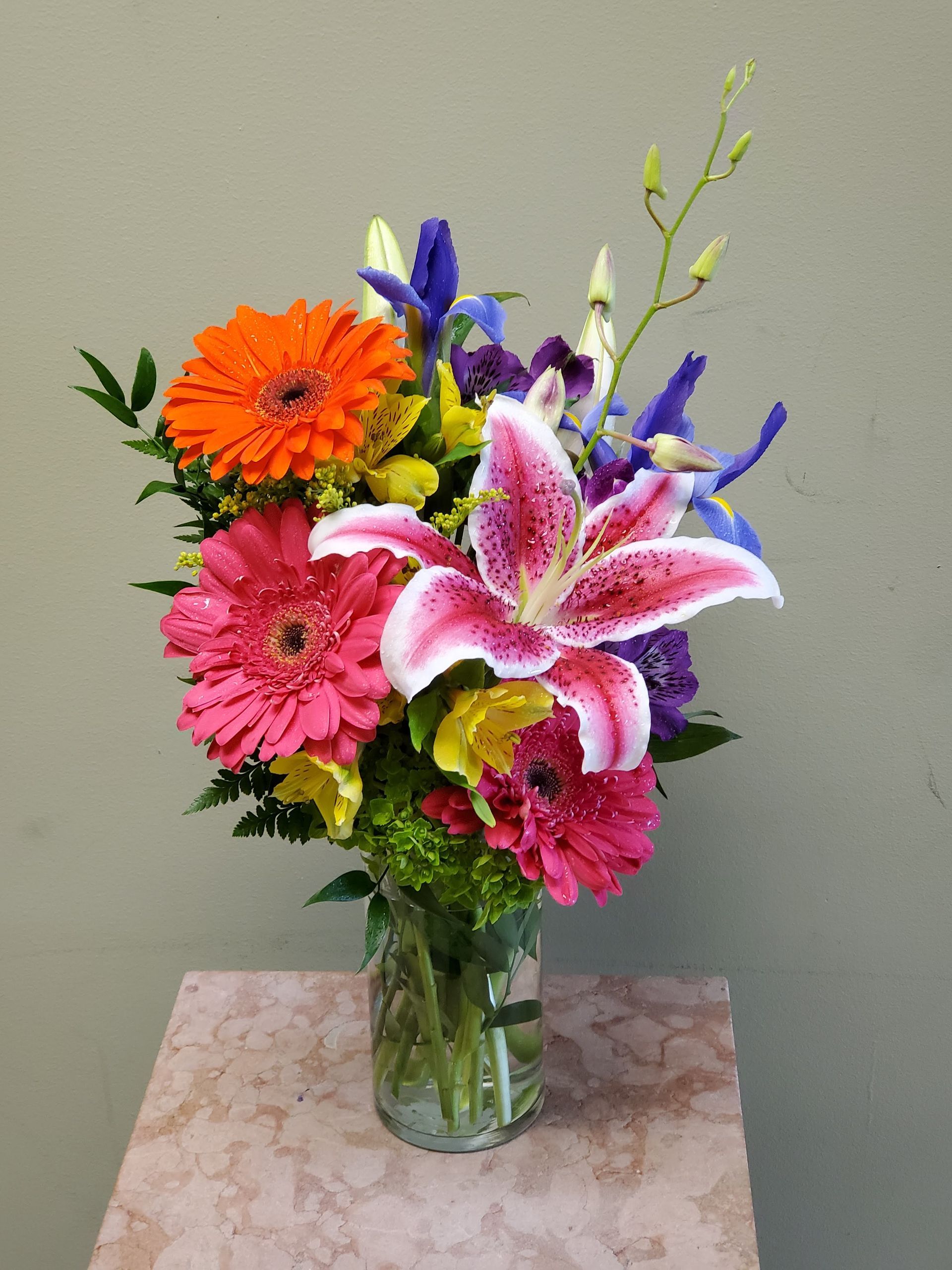 A vase filled with flowers is sitting on a table.