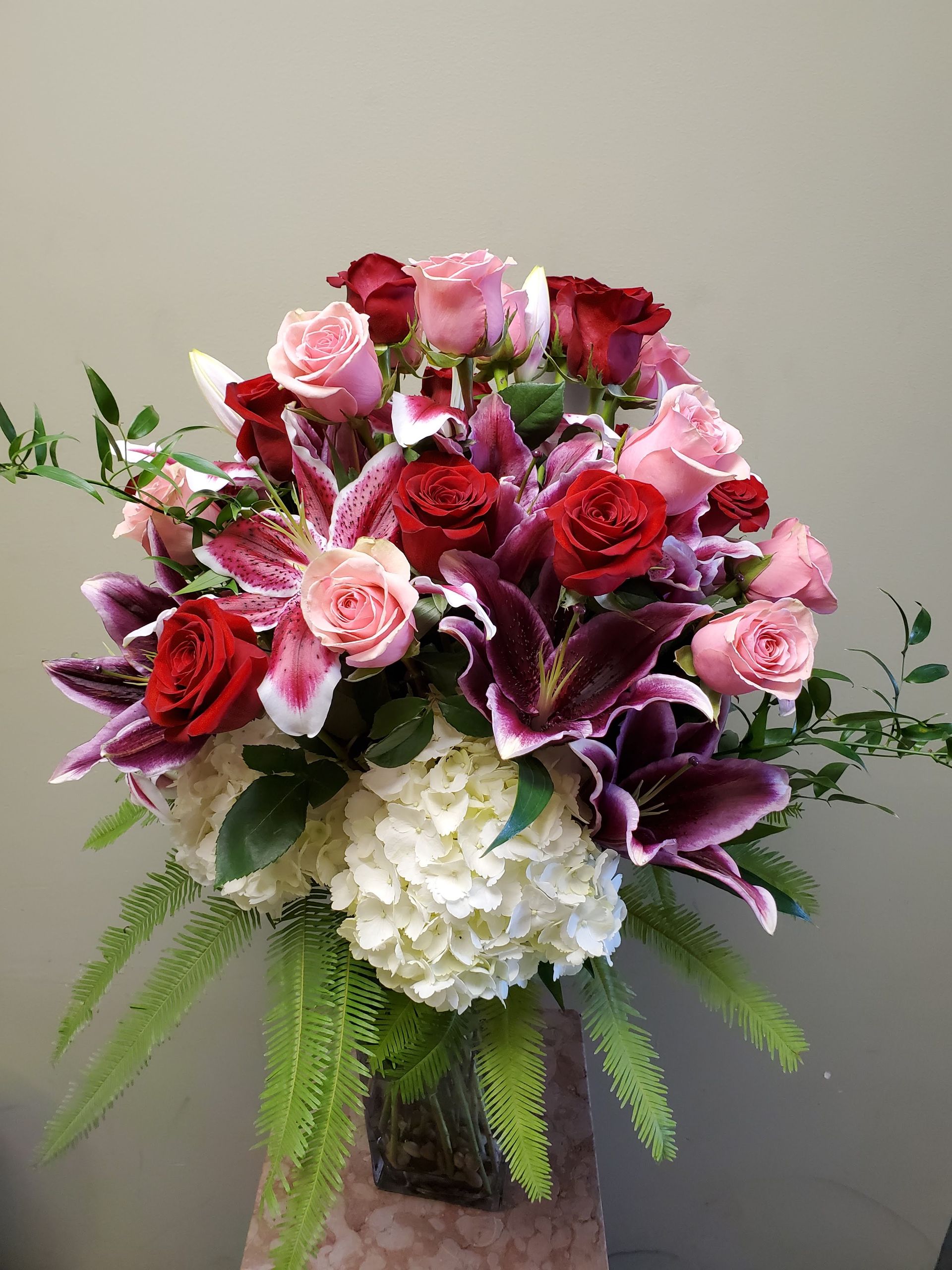 A vase filled with flowers is sitting on a table.