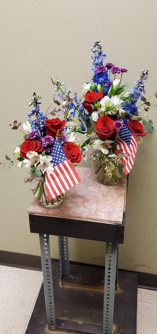 A vase filled with flowers is sitting on a table.