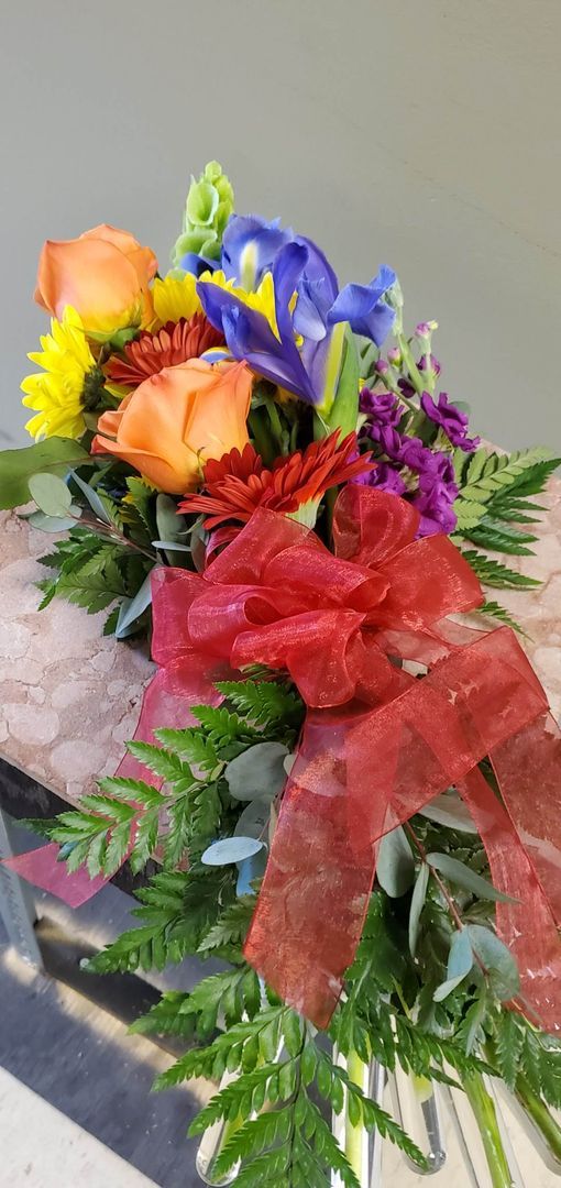 A vase filled with flowers is sitting on a table.