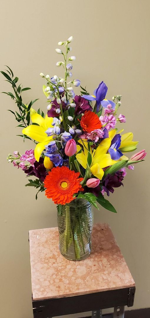 A vase filled with flowers is sitting on a table.