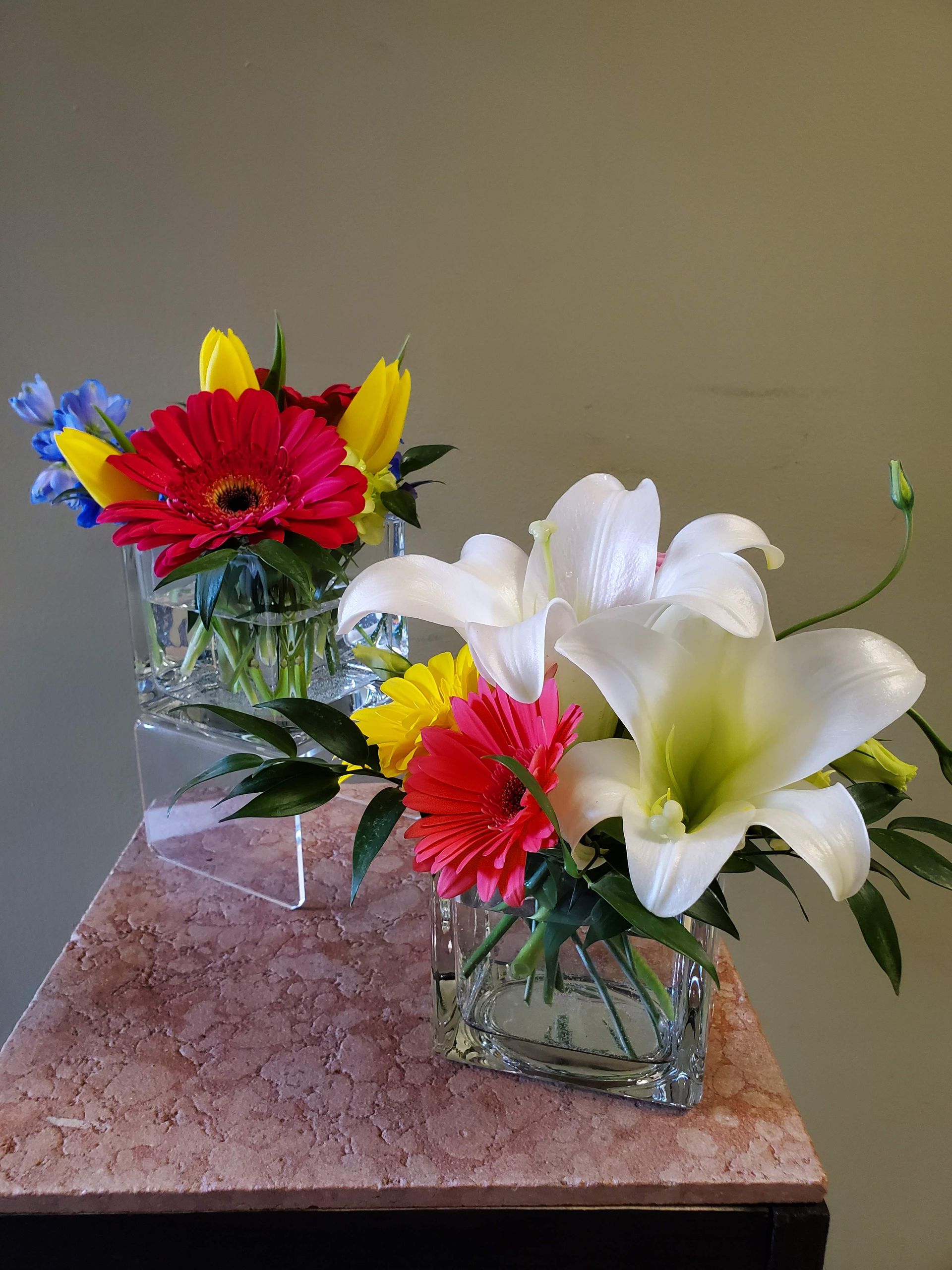 A vase filled with flowers is sitting on a table.