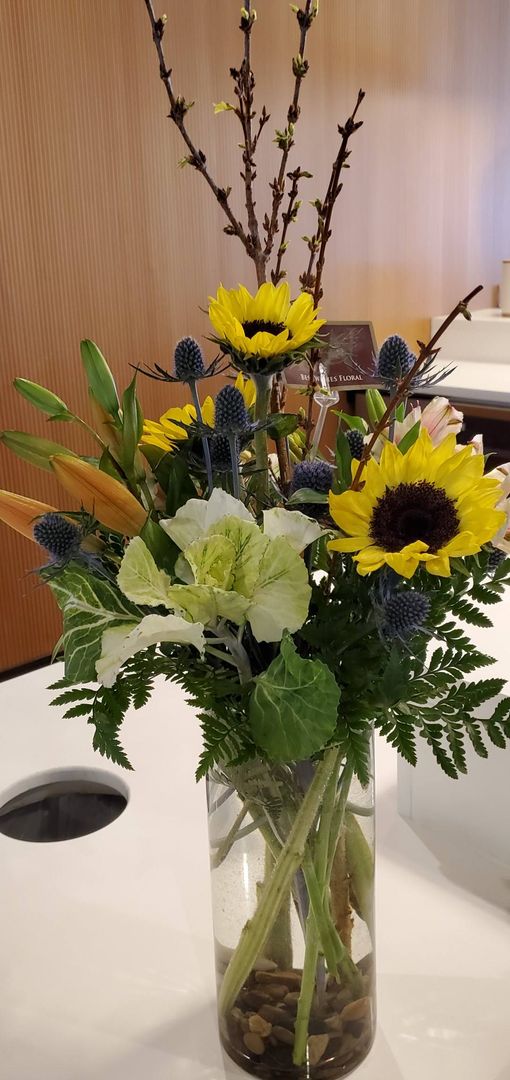 A vase filled with flowers is sitting on a table.