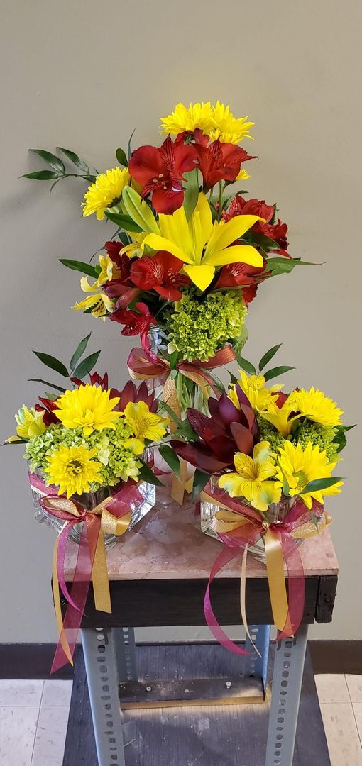 A bunch of flowers are sitting on top of a table.