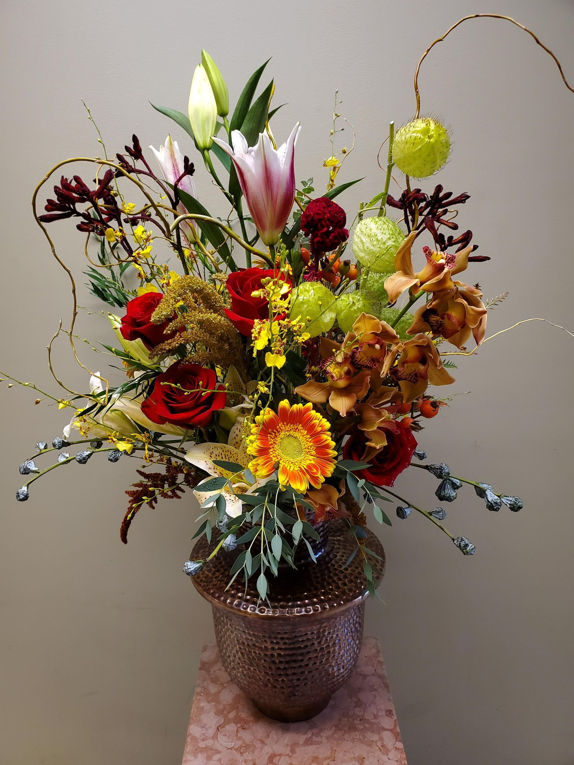 A vase filled with flowers is sitting on a table.